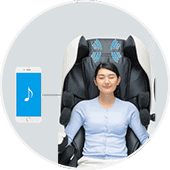 Bluetooth speakers next to shoulders of Inada Robo massage chair 