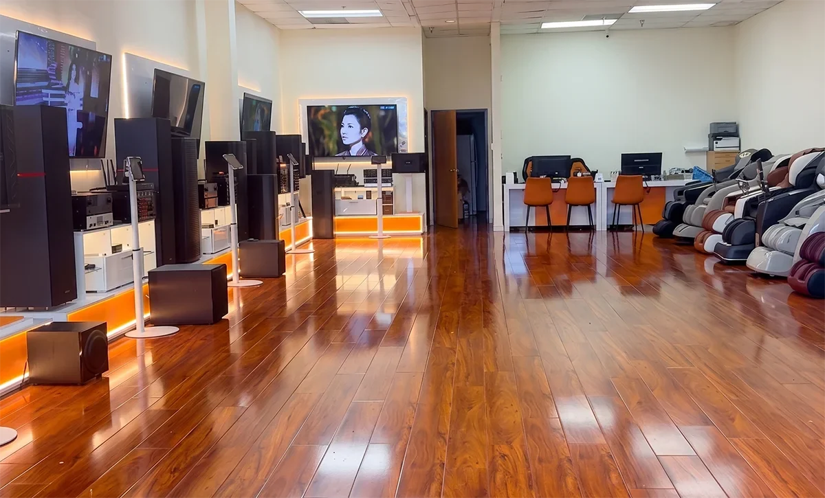 Wide interior view of Tittac showroom with karaoke systems and massage chairs in Garden Grove