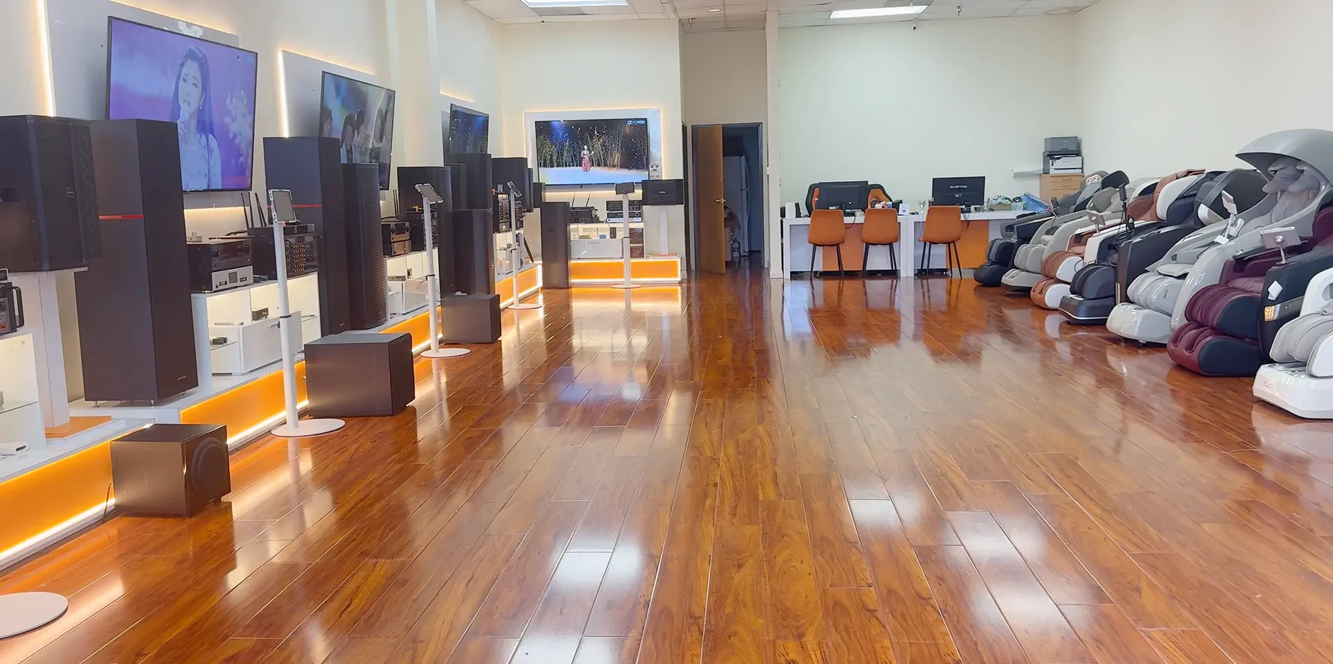Inside Tittac’s Garden Grove showroom with home karaoke systems and massage chairs on display